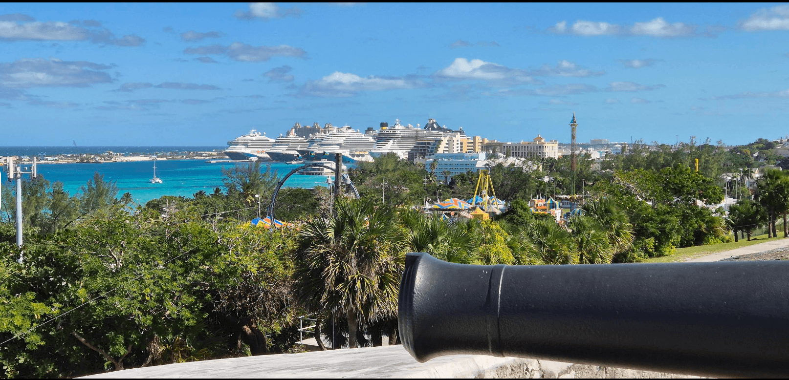 A cannon at Fort Charlotte overlooking Nassau Harbour and cruise ships