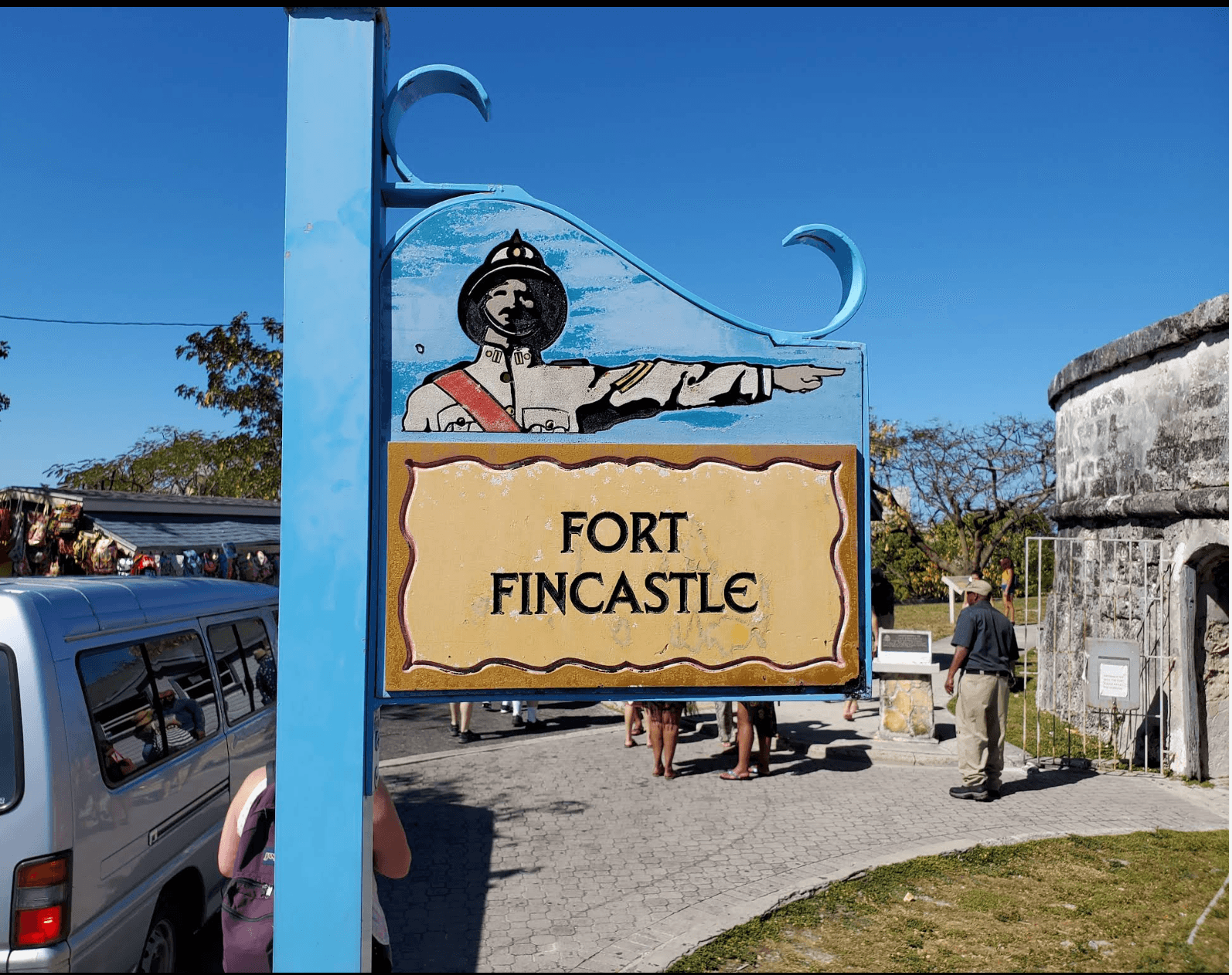 Fort Fincastle sign beside the stone fort entrance in Nassau