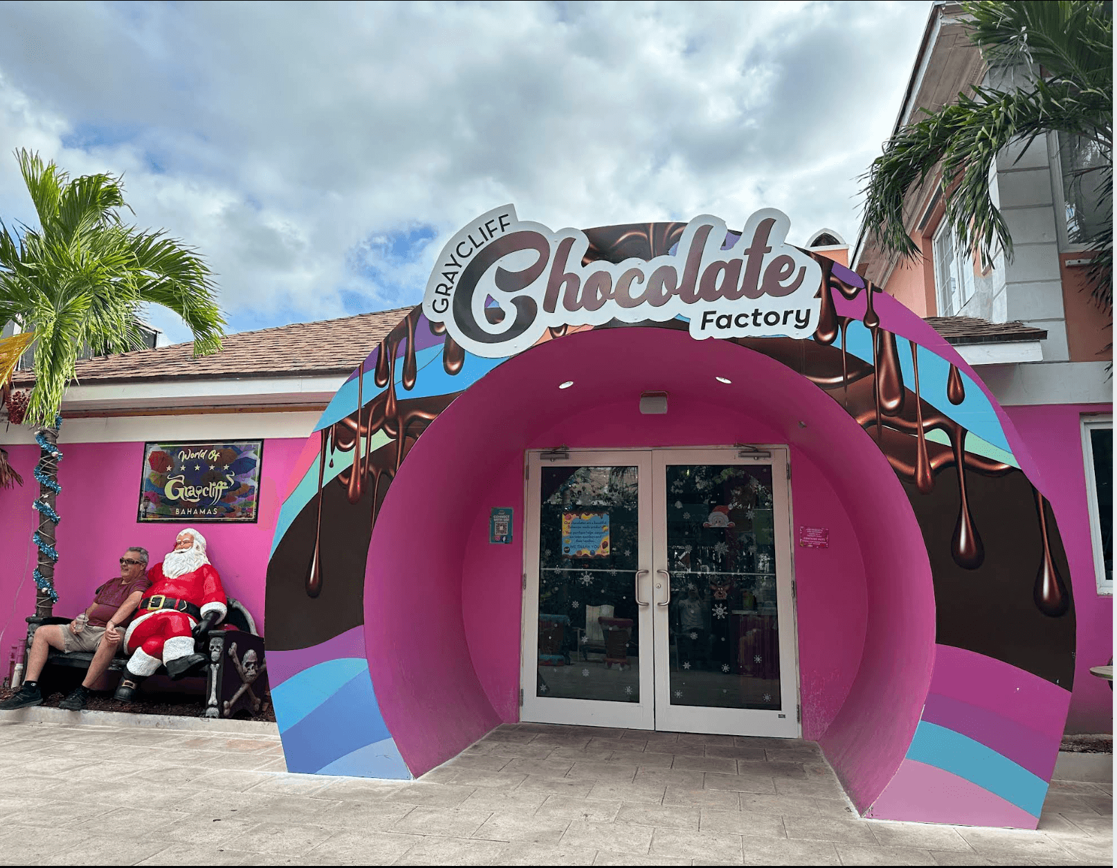 Pink entrance and Chocolate Factory sign at Graycliff Chocolatier in Nassau