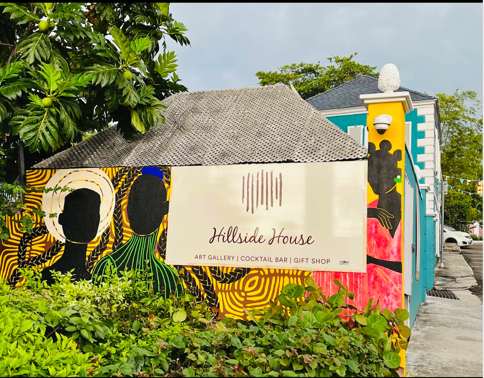 Hillside House Gallery sign and colourful painted exterior in Nassau