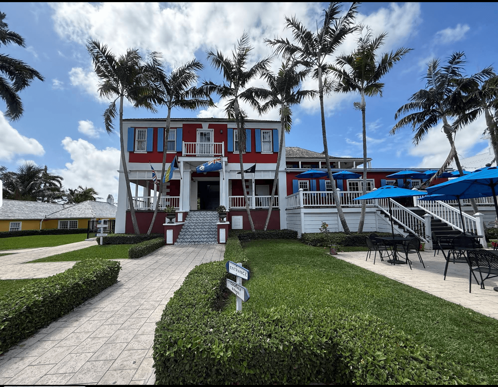 John Watling’s Distillery at Buena Vista Estate, with palm trees and a landscaped entrance